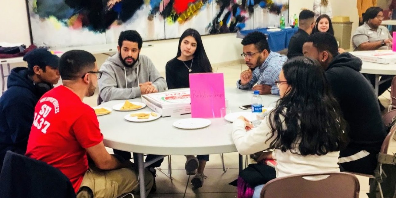 A diverse group of college students sharing a meal 