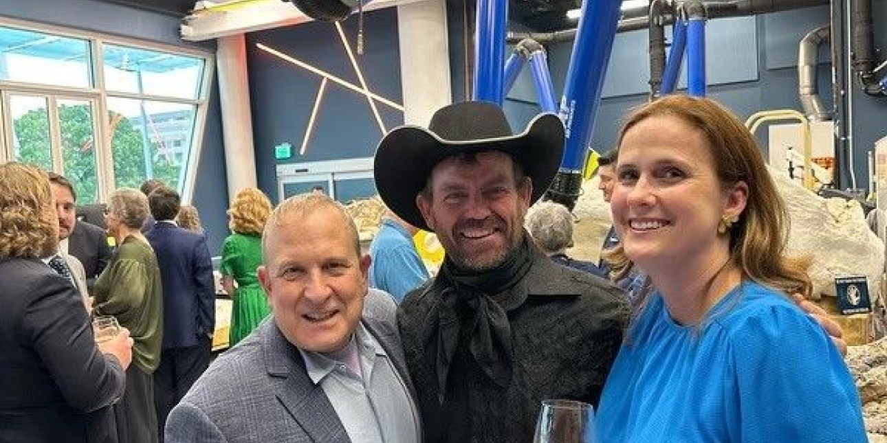 Clayton Phipps, professional cowboy dinosaur hunter who found the Triceratops intersected with a T. Rex by first spotting a pelvis bone visible to his well-trained eye in a Montana stream (the dinos are behind me, Phipps, and Alice Tate). 